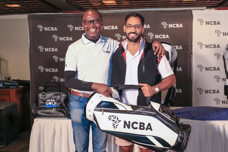 NCBA Group Director for Asset Finance, Lennox Mugambi (L) hands over prize to Sarat Singh, the overall winner of the NCBA Golf Series at Great Rift Valley Lodge & Golf Resort.