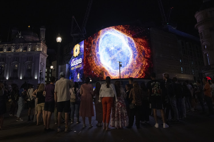 A general view of the broadcast of Nasa's first images from James Webb Space Telescope to screens in Picadilly Circus on July 12 2022 in London, England. The imagery was also broadcast to screens in Times Square in New York as part of a global collaboration between Landsec and Nasa.