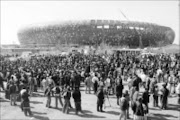 CHAOTIC: Construction workers demonstrate outside the Soccer City Stadium, south of Johannesburg, which is one of
the venues for the 2010 World Cup. The workers are demanding a 13 percent wage increase. Pic: Veli Nhlapo. 08/07/2009. © Sowetan