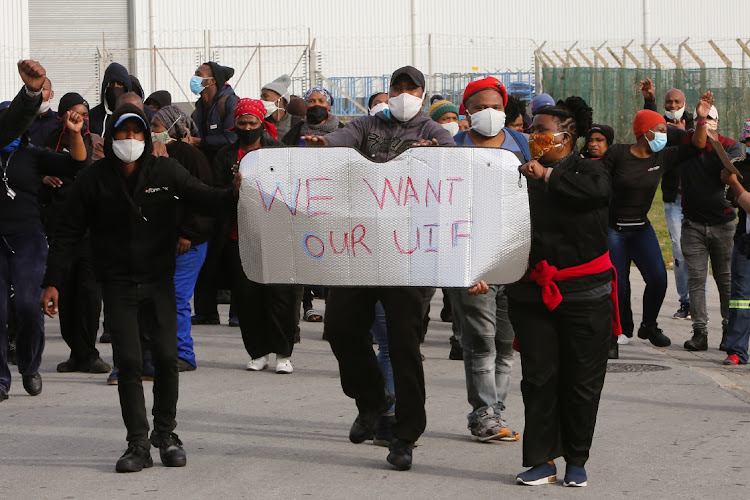 Employees at Formex in Markman protest outside the business on Thursday