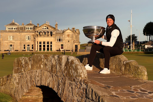 Danny Willett of England poses with the trophy on the Swilcan Bridge on the 18th hole following victory during Day Four of The Alfred Dunhill Links Championship at The Old Course on October 03, 2021 in St Andrews, Scotland.