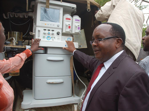 Tharaka Nithi Governor Samuel Ragwa examines the Sh4 million anesthetic machine on Thursday. The machine was found in Mwiki, Nairobi / DENNIS DIBONDO