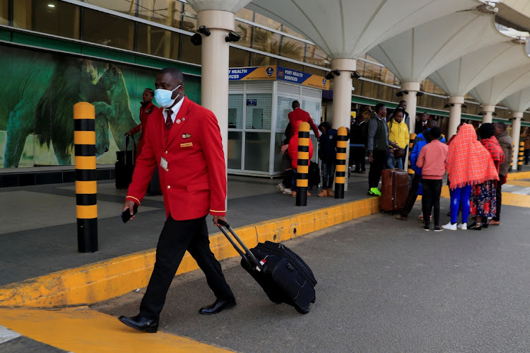 An employee of Kenya Airways pulls his flight case during a strike, by the pilots of Kenya Airways, organised by Kenya Airline Pilots Association (KALPA) at the Jomo Kenyatta International airport in Nairobi, Kenya November 5, 2022. REUTERS/Thomas Mukoya