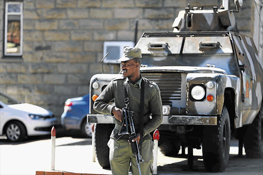 WHO'S IN CHARGE? A police officer was killed when soldiers raided the police headquarters in Maseru, Lesotho, on Saturday. Both the prime minister and his deputy are in South Africa and it was not clear who was in charge of the country last night