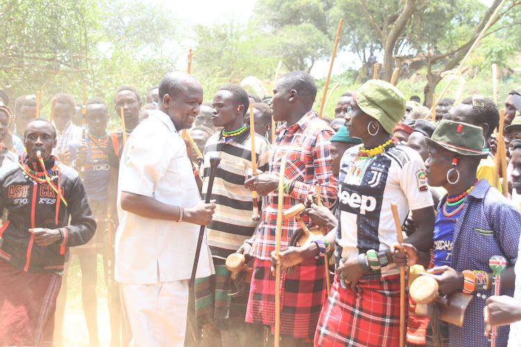 Tiaty MP William Kamket joins traditional dancers while heading to be installed as a Pokot elder and spokesperson in Tangulbei-Korossi ward in Baringo county on August 17.