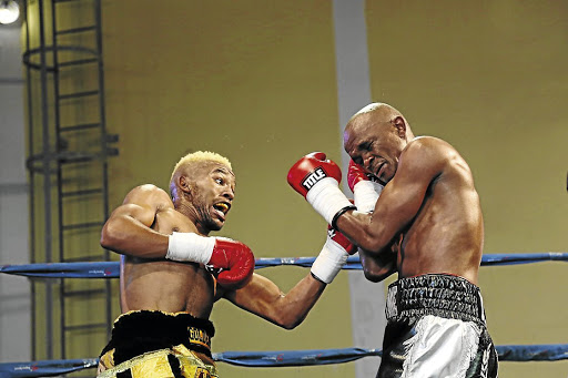 Azinga Fuzile, left, hits out at Malcolm Klassen during a bout that was named 2018 Africa's fight of the year by IBF. Fuzile is being prepared for a world title fight.