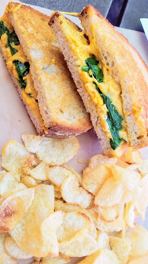 Of Roots and Blooms pops up every Wednesday at Bottles on Fremont and Sundays at Culmination Brewing offering rotating vegan delights. This grilled cheese with cashew fromage fort, cheddar, spinach, toasted levain and side of chips reminds me when I first fell in love with them as a Cheese Plate cart.