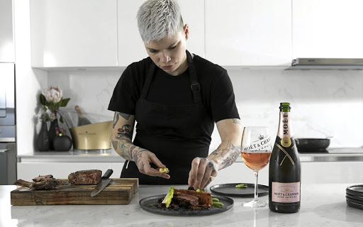 Chef Ash Heeger plates a dish of the delicious food at the Moët & Chandon pairing in Cape Town.