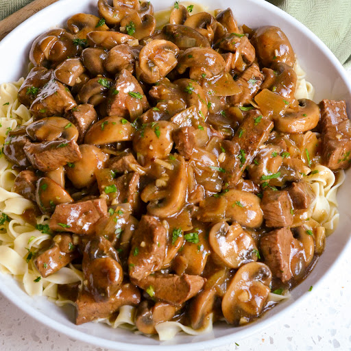 A quick and delicious no canned soup Beef and Noodles recipe with onions, garlic, and white button mushrooms all in an easy to make gravy made right in the same pot. 