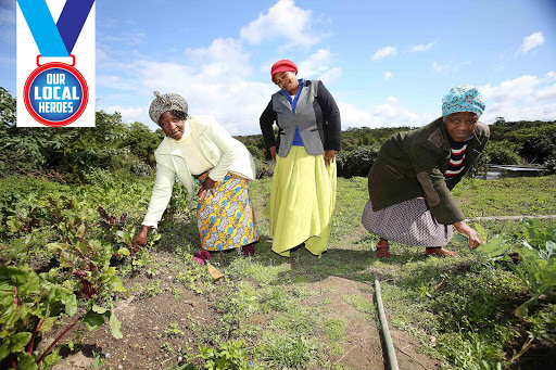 MAKING A DIFFERENCE: Thobeka Mayatula, left, Funeka Qhutywa, centre, and Nosisana Ntoyeni run a soup kitchen for needy children and adults, at Santa township Picture: MARK ANDREWS