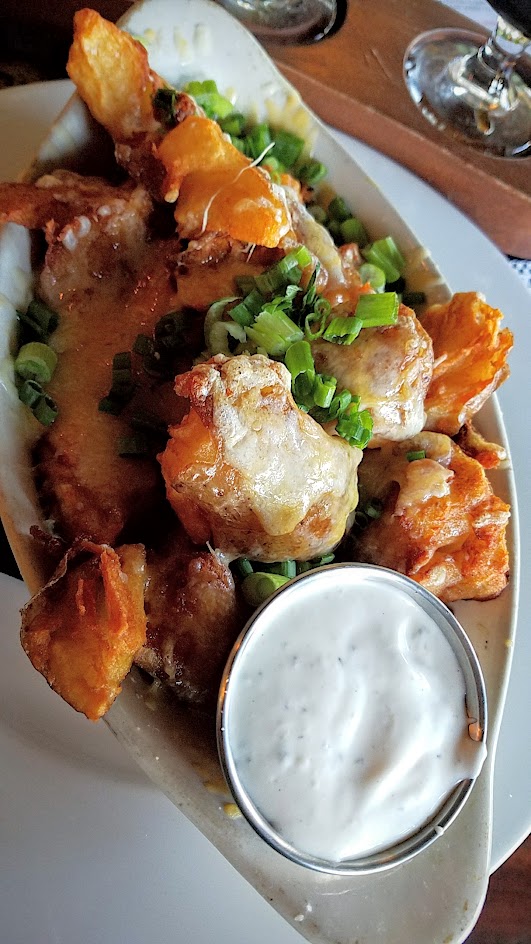 Saraveza appetizer of Potato Melt with cheddar, scallion and ranch dressing