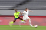 Tierna Davidson of Team United States battles for possession with Madelen Janogy #7 of Team Sweden during the Women's First Round Group G match between Sweden and United States during the Tokyo 2020 Olympic Games at Tokyo Stadium on July 21, 2021 in Chofu, Tokyo, Japan. 