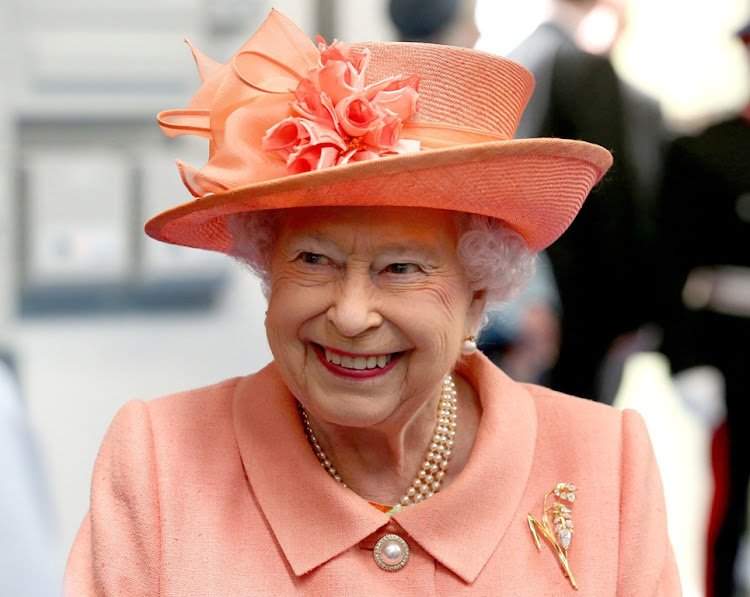 Queen Elizabeth wears The Botswana flower brooch designed by Kevin Friedman.