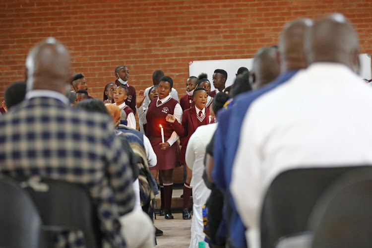 The Lesiba High School choir bids farewell to their classmates in song at a memorial service at the school.