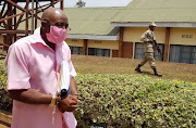 FILE PHOTO: Paul Rusesabagina, portrayed as a hero in a Hollywood movie about Rwanda's 1994 genocide, is escorted in handcuffs from the courtroom in Kigali, Rwanda September 25, 2020. 