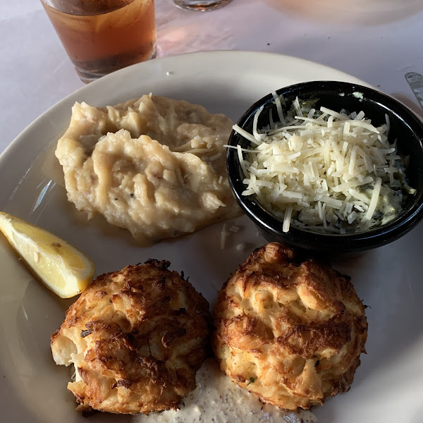 Crab cakes with mashed potatoes and creamed spinach