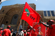 EFF supporters sing outside the Johannesburg high court during the party's legal battle with AfriForum over
the 'Kill the Boer’ song. 