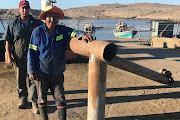 Diamond miners Jeff Johnson and George Nicolaai in Alexander Bay harbour.