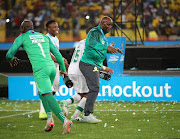 Pitso Mosimane, coach of Mamelodi Sundowns celebrates a victory with Andile Jali, Keletso Makgalwa and Kennedy Mweene during the 2019 Telkom Knockout final match between Maritzburg United and Mamelodi Sundowns at Moses Mabhida Stadium Durban, on 14 December 2019.