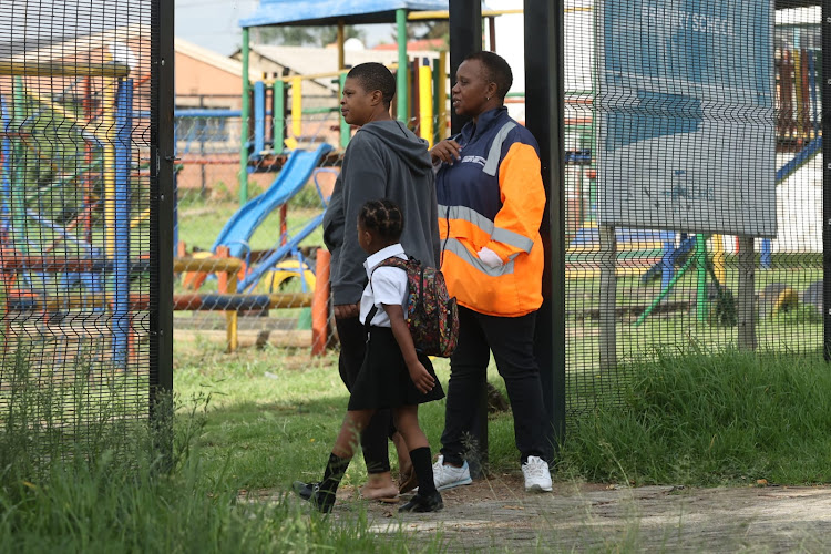 A learner is accompanied by her parent at Nonto primary school.