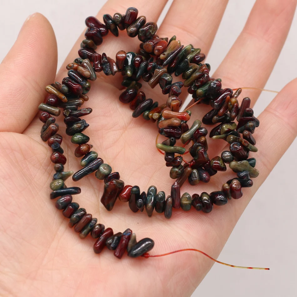 Ongeregelde kralen van kleurrijk koraal om unieke sieraden te maken. Creëer opvallende ontwerpen en geef je stijl een boost.