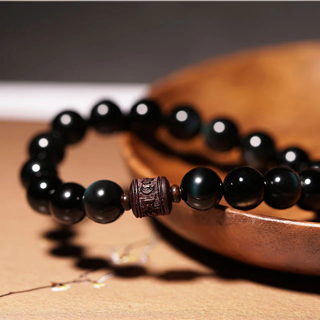Obsidian Lobular Red Sandalwood Hand String for Men, a meditation bracelet promoting calm and focus. Enhance your well-b