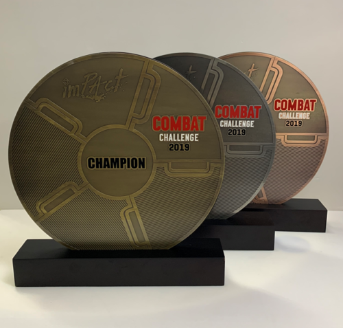 Three round metal plaques for a combat challenge