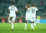 Kudakwashe Mahachi and Luvuyo Memela of Orlando Pirates players celebrates a goal during the CAF Champions League match between Orlando Pirates and Platinum at Orlando Stadium, Johannesburg on 08 March 2019.