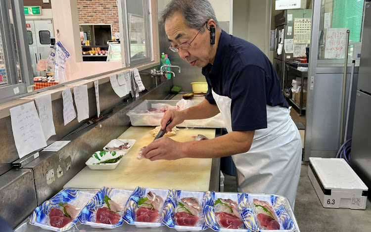 Supermarket owner Takashi Nakajima, 67, prepares sashimi, or raw fish, to sell at his store, near the tsunami-crippled Fukushima Daiichi nuclear power plant, in Soma, Fukushima prefecture, Japan, August 9, 2023. REUTERS/AKIKO OKAMOTO