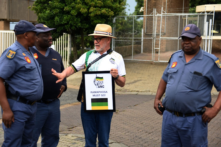 ANC member Carl Niehaus carrying a placard 'Ramaphosa must go' at the ANC special NEC meeting at Nasrec Expo Centre in Johannesburg. File photo.