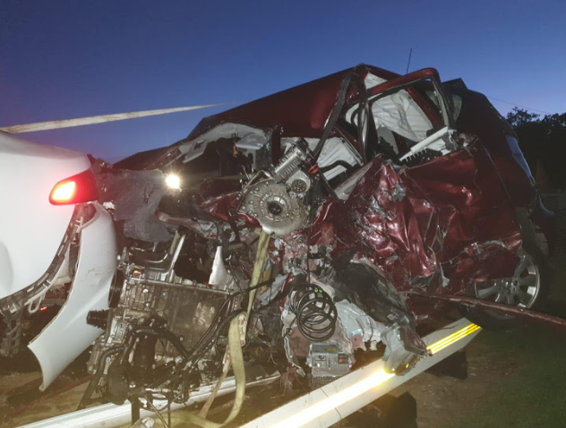 The maroon Mercedes and white Jaguar after a collision on the R72 near Port Alfred