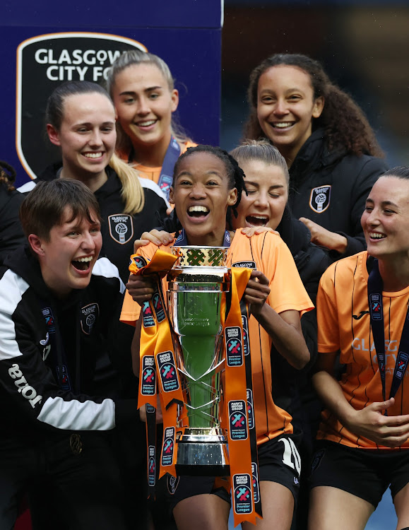 Linda Motlhalo and her Glasgow City teammates celebrate with the trophy after a 1-0 victory that secured the club the Scottish Women's Premier League.