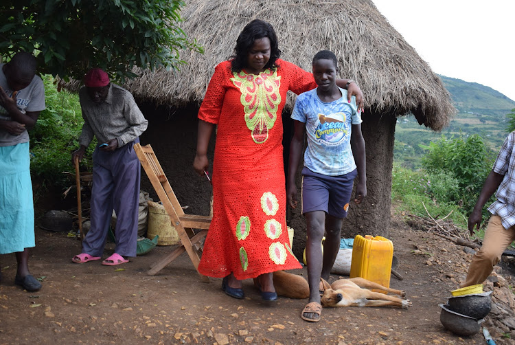 Homa Bay Woman Representative Gladys Wanga and Austin Omondi at the boy's home in Malongo village, Suba South constituency, on January 16, 2020.