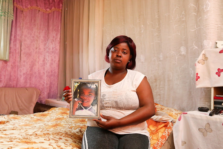 Jorica Kiewiets,17, from Concordia in Knysna, with a picture of her twin sister, Jorina, who died in the accident