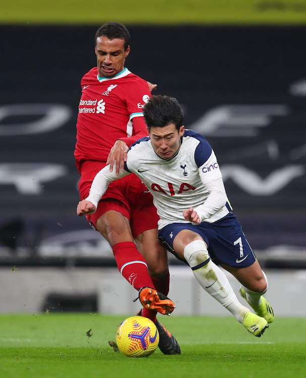 Liverpool's Joel Matip in action with Tottenham Hotspur's Son Heung-min