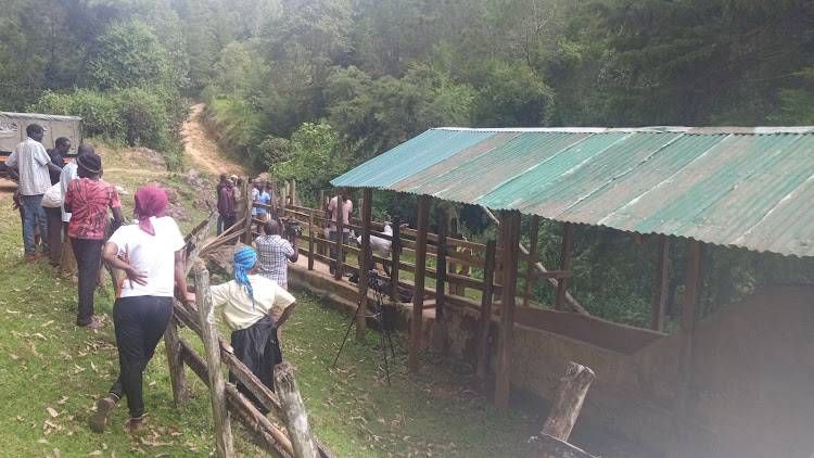 Residents mill around the scene at Engos cattle dip in Kabarnet, Baringo Central subcounty where a 25-year old man was found dead.