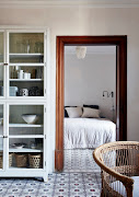 The main bedroom leads off the open-plan living and dining room. 