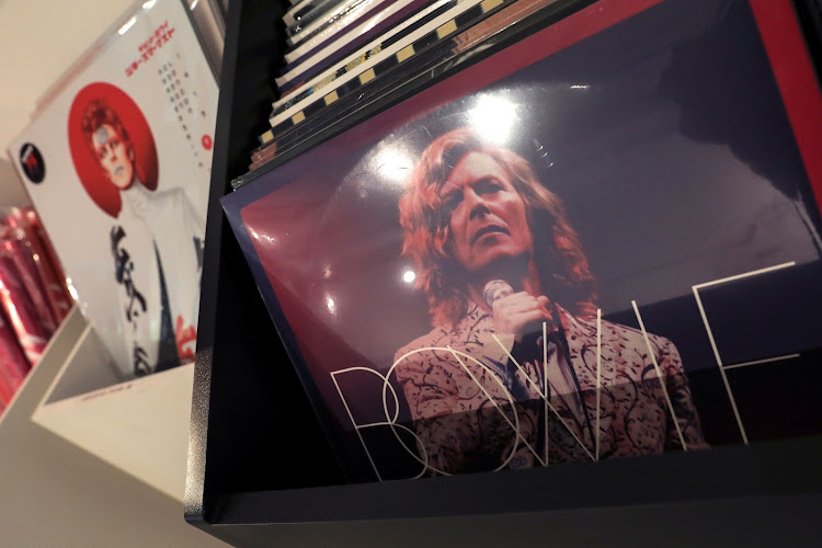 Albums by the late rock and roll artist David Bowie for sale are pictured inside "Bowie 75".