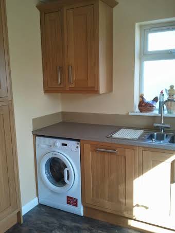 Oak frame kitchen with glass splash back album cover