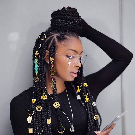 A girl with bohemian chic accessories on her hair.