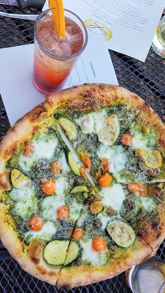 Ken's Artisan Pizza, 12 inch thin crust perfection, this one is the Summer Pesto with zucchini, cherry tomatoes, hazelnut pesto, mozzarella, pecorino romano along with the cocktail Negorni Sbagliato with Meletti 1870 bitter, Cinzano Sweet, Sparkling Wine, orange wheel