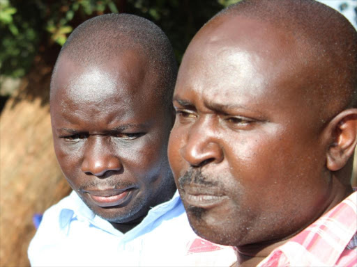 Francis Auma the rapid response officer at Muhuri and Samuel Wandimi from Infoaction addressing the media in Nyeri on Monday