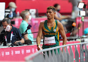 Wayde van Niekerk of SA walks towards a post-race television interview after he ran in the heats during the Tokyo Olympic Games.