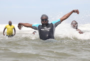 Ethekwini mayor Mxolisi Kaunda goes for a swim at Durban's North Beach last year to prove the water was safe.  File photo.