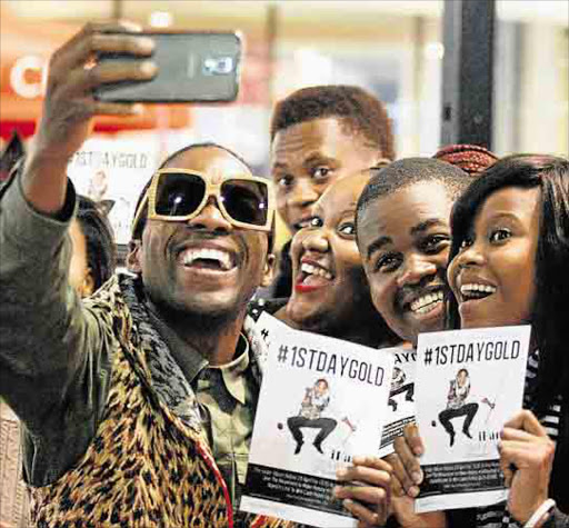 LOOKING GOOD: iFani takes selfies with fans at the Greenacres mall in Port Elizabeth Picture: Picture: FREDLIN ADRIAAN