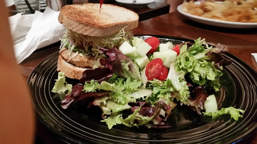 The California Turkey Burger -- healthy-sized portion, topped with pico de gallo and avocado on Udi's multi-grain. And served on a black plate to differentiate it from the white-plated gluten-containing meals!