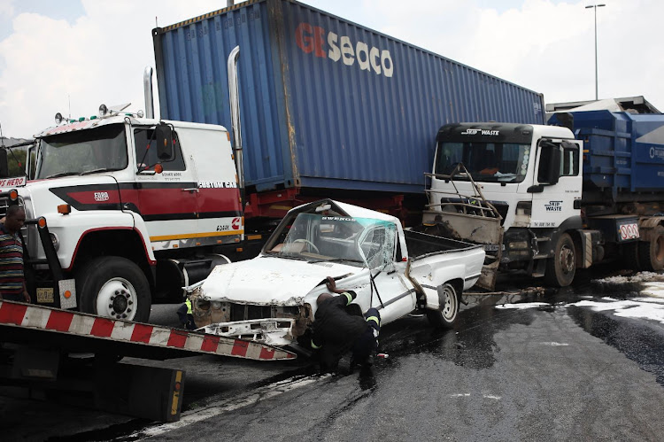 The accident scene on the N1 north near Northcliff, Johannesburg is pictured. The incident happened after a truck crashed into queuing traffic from another accident. The crash damaged 18 vehicles and three trucks which caused multiple injuries and a temporary closure of the highway.