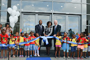 Manufacturing, Engineering and Related Services Sector Education and Training Authority chief executive Raymond Patel, former minister of higher education and training Hlengiwe Mkhize and BMW Group South Africa CEO Tim Abbott cut the ribbon at the official opening of Plant Rosslyn’s R73-million training academy.