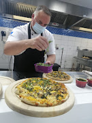 Chef Mark Coombe puts the finishing touches on the winning pizza in the Global Pizza Challenge SA 2021.