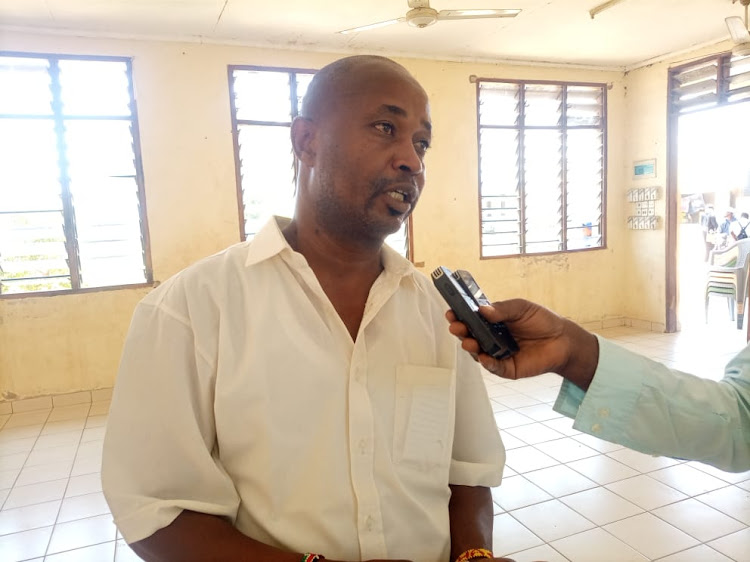 Kecosce field officer Mwalimu Rama at Kombani Social Hall in Matuga, Kwale on Saturday.